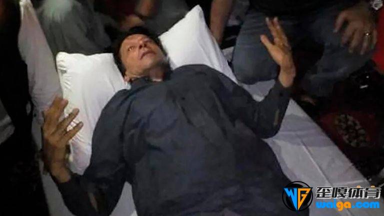 In this photo released by former Pakistani Prime Minister Imran Khan&#39;s party, Pakistan Tehreek-e-Insaf, Imran Khan, who injured in a shooting incident, is seen after the incident, in in Wazirabad, Pakistan, Thursday, Nov. 3, 2022. A gunman opened fire at a campaign truck carrying Khan on Thursday, wounding him slightly and also some of his supporters, a senior leader from his party and police said. (Pakistan Tehreek-e-Insaf via AP)